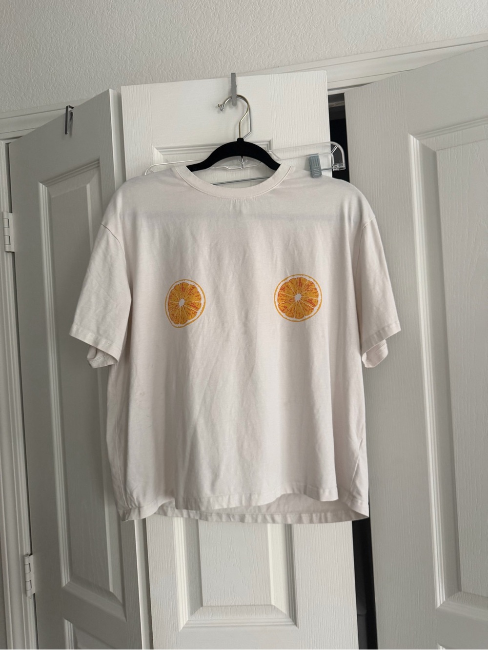 Never Fully Dressed White Tee with Orange Slice Motifs